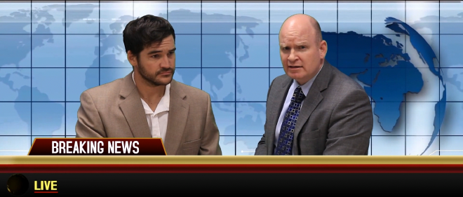 Two news anchors sit on set with a generic background. A “Breaking News” title card is displayed, as well as a “Live” card. Beside the live card, where a news ticker would normally be displayed, is completely blank.