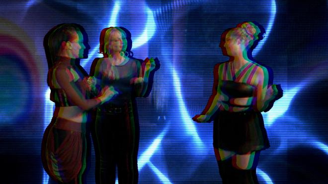 Our three heroines, dancing in a club. The background is distorted with an analog effect, while their bodies appear to be phasing partially in and out of a different dimension or universe.