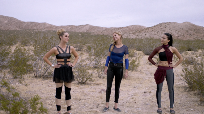 The three heroines of the film, standing out in the desert. They are wearing variations of women&rsquo;s athletic wear that are modified and meant to look futuristic.