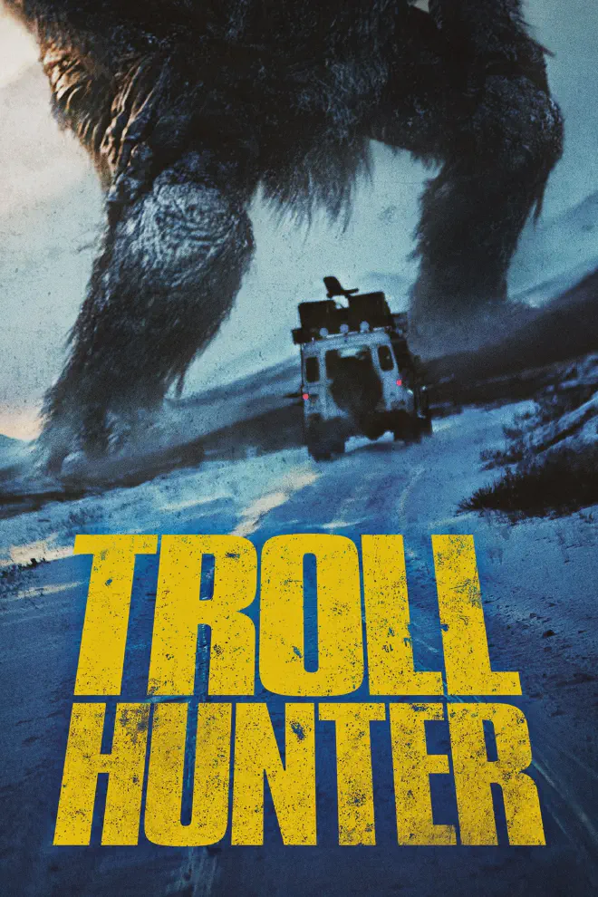 The poster art for the film Troll Hunter. A white jeep with a lot of equipment attached to it is seen driving down a road away from the camera, which is titled to one side. In the background is the lower half of a very large troll.